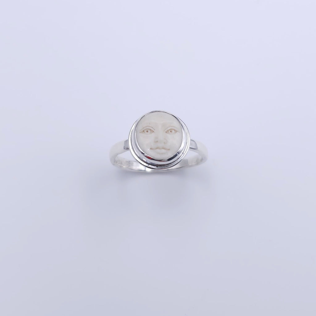 Sterling silver carved face ring