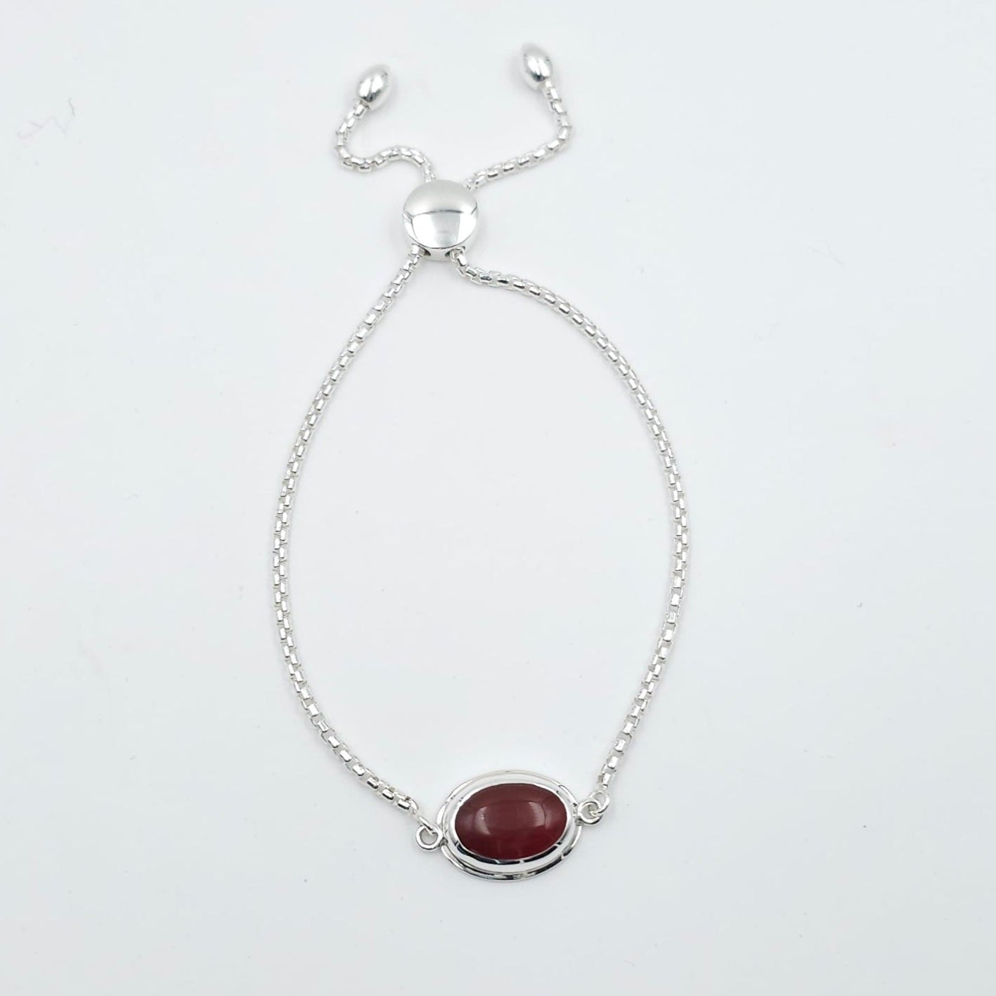 Adjustable silver chain bracelet with oval bezel set orange-red carnelian gemstone