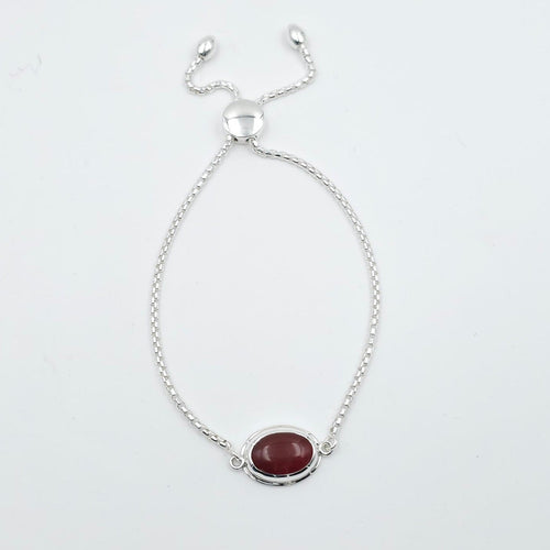 Adjustable silver chain bracelet with oval bezel set orange-red carnelian gemstone