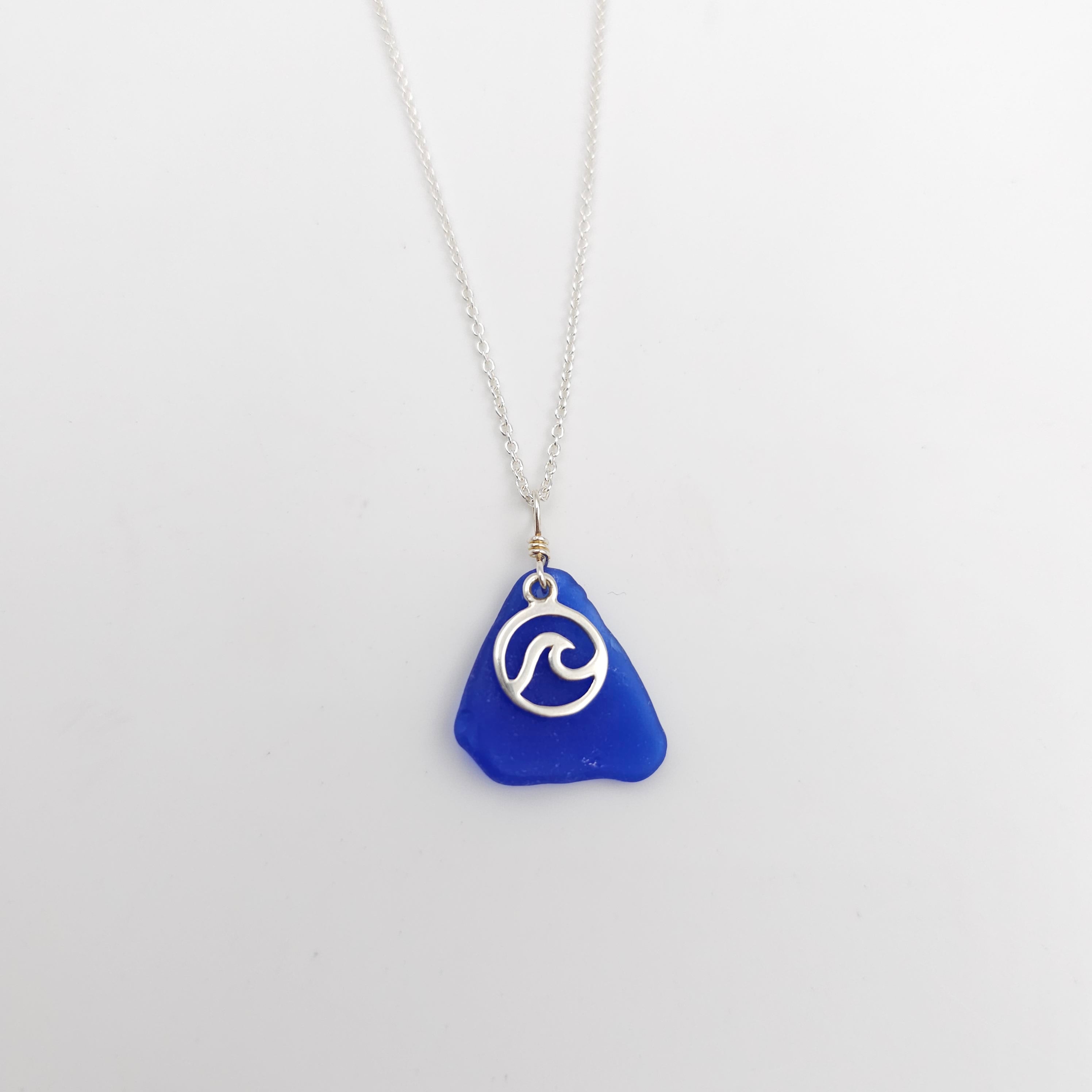 Blue sea glass necklace with wave in circle