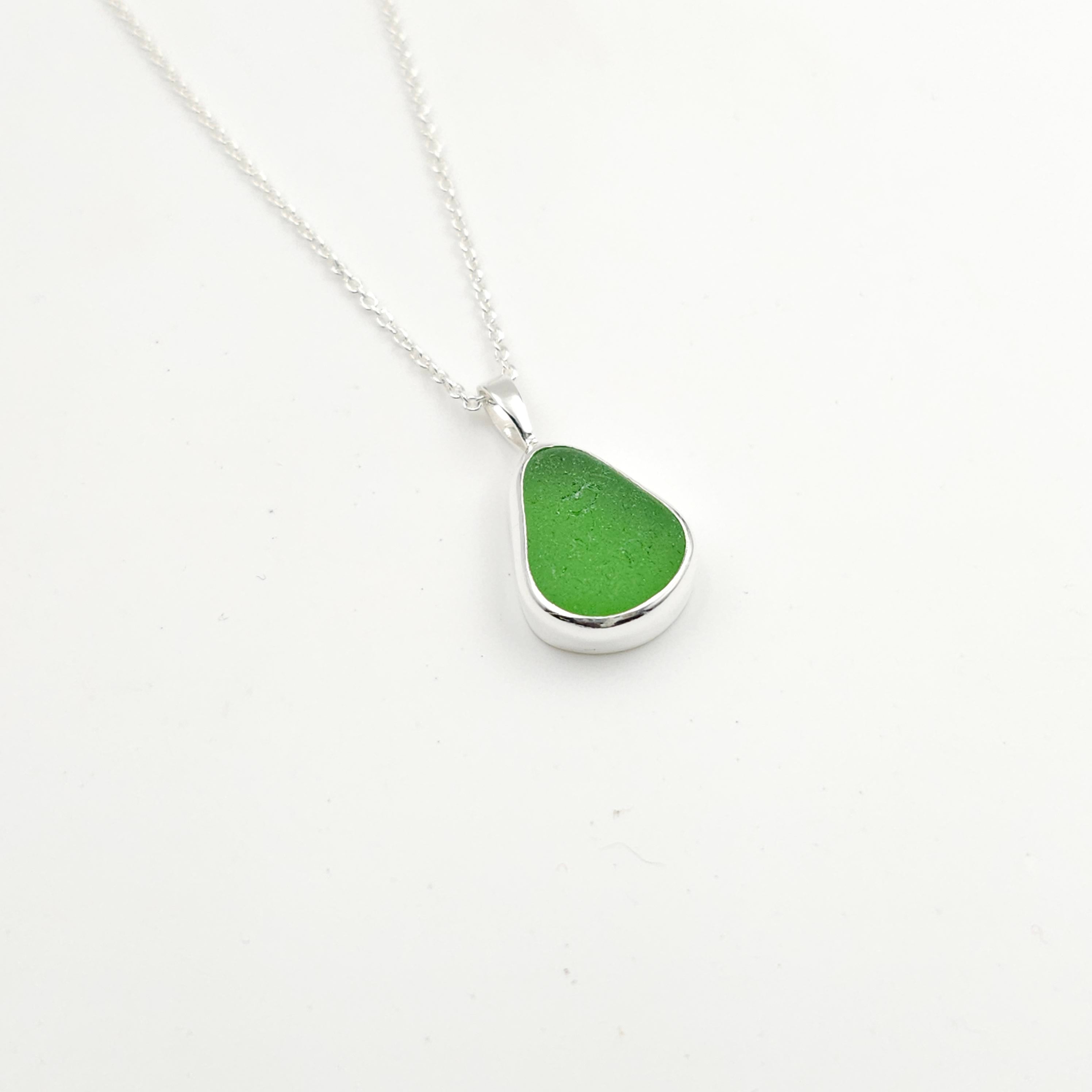Green bezel set necklace teardrop shaped in sterling silver