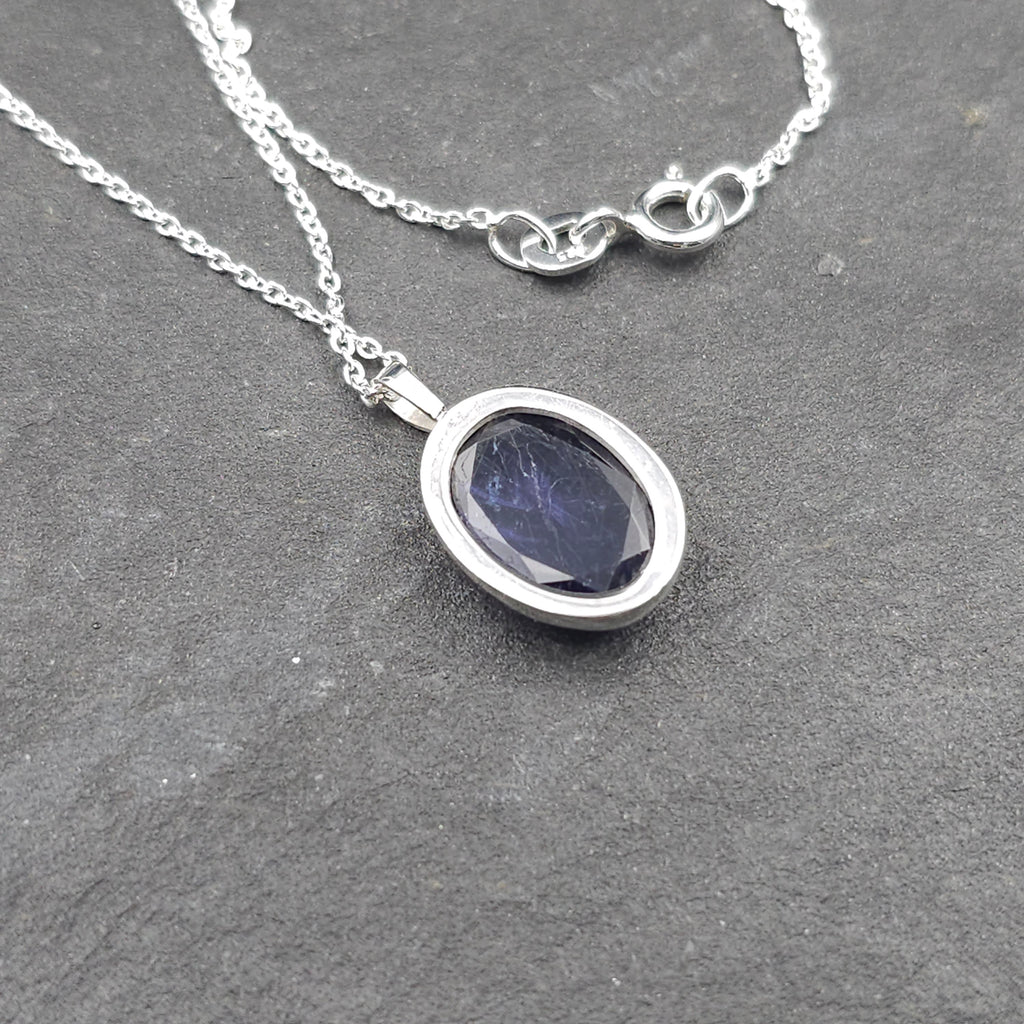 Carved iolite bezel set sterling silver necklace