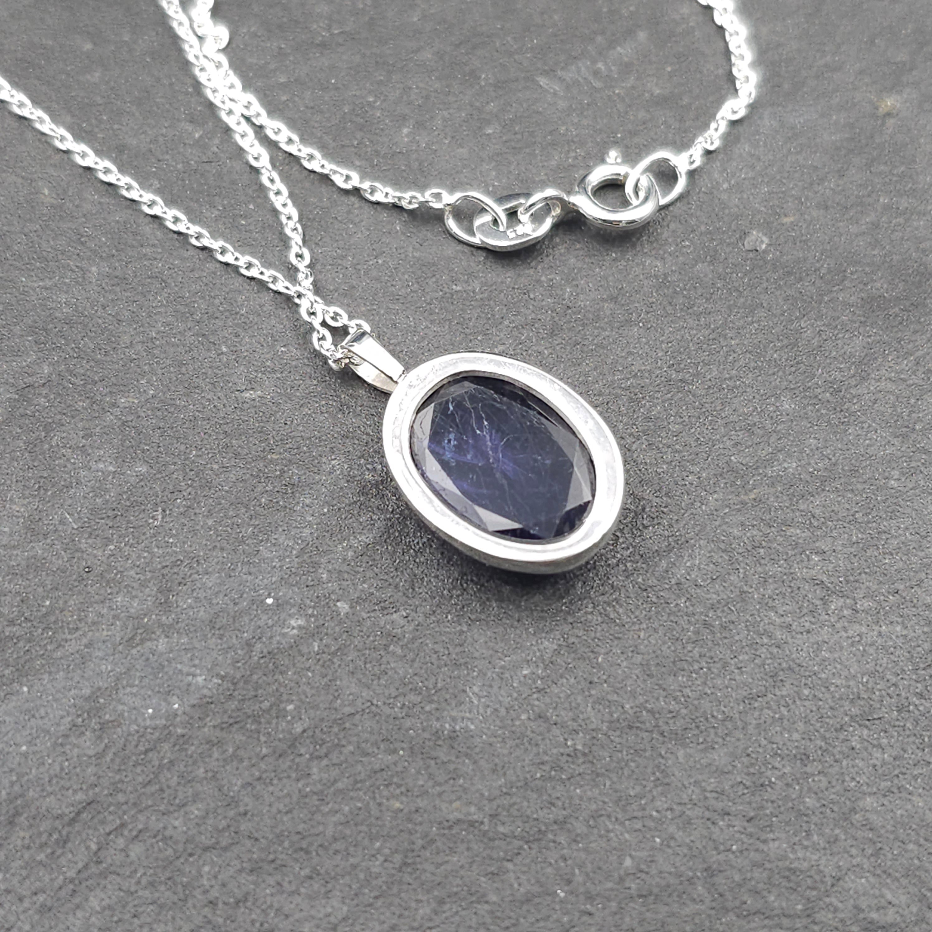 Carved iolite bezel set sterling silver necklace
