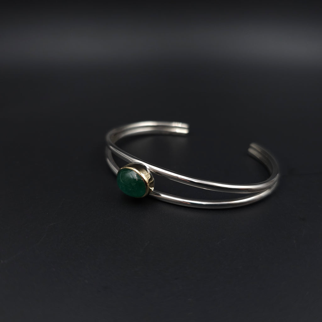 Sterling silver emerald cuff bracelet with 18k gold bezel