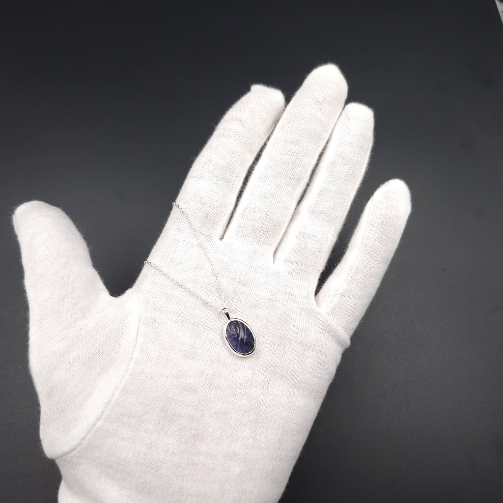Carved iolite bezel set sterling silver necklace