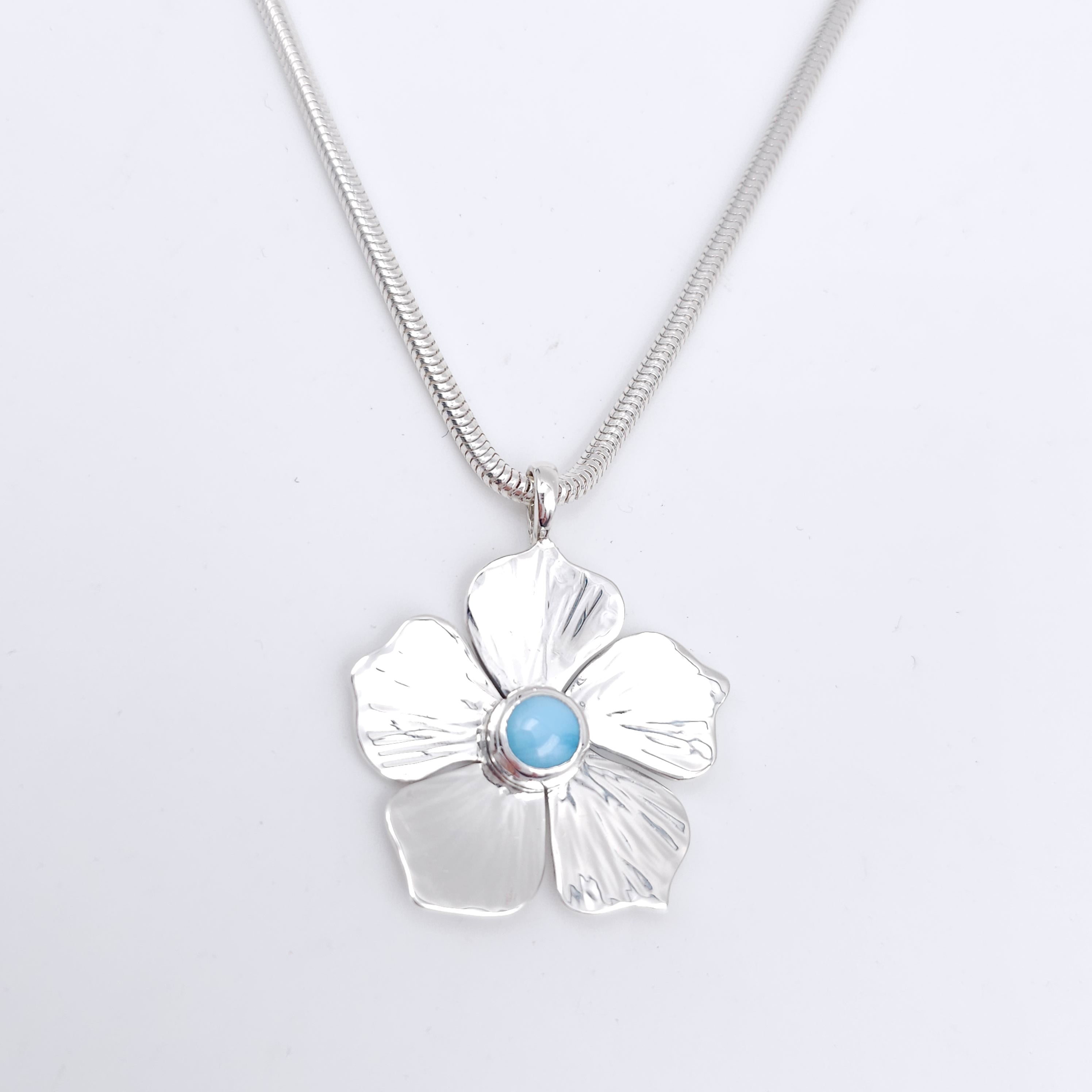 Silver flower necklace with Larimar