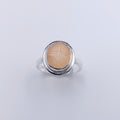 Peach moonstone with leaves carved into stone silver ring