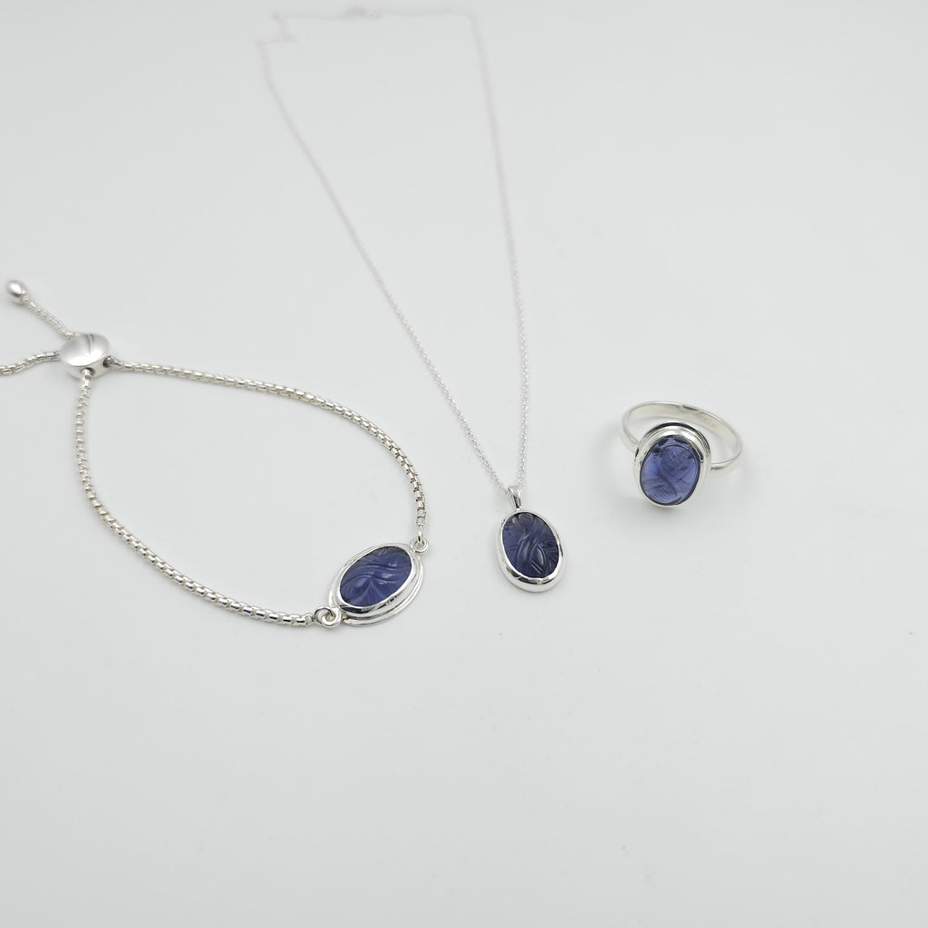 Carved iolite bezel set sterling silver necklace