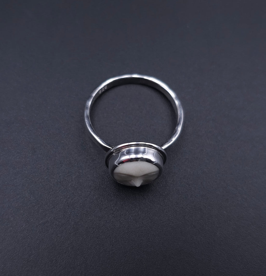 Sterling silver carved face ring