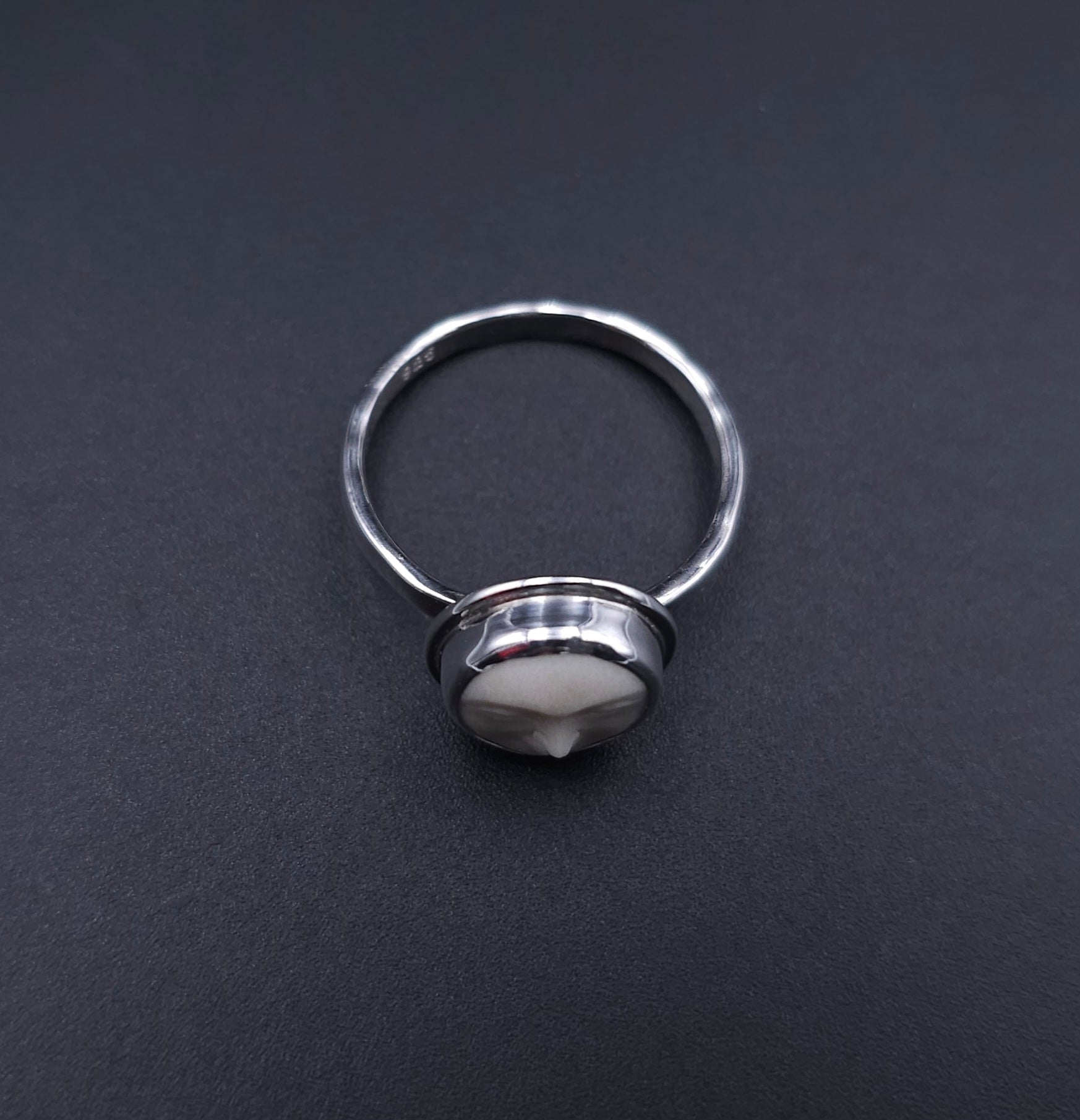 Sterling silver carved face ring