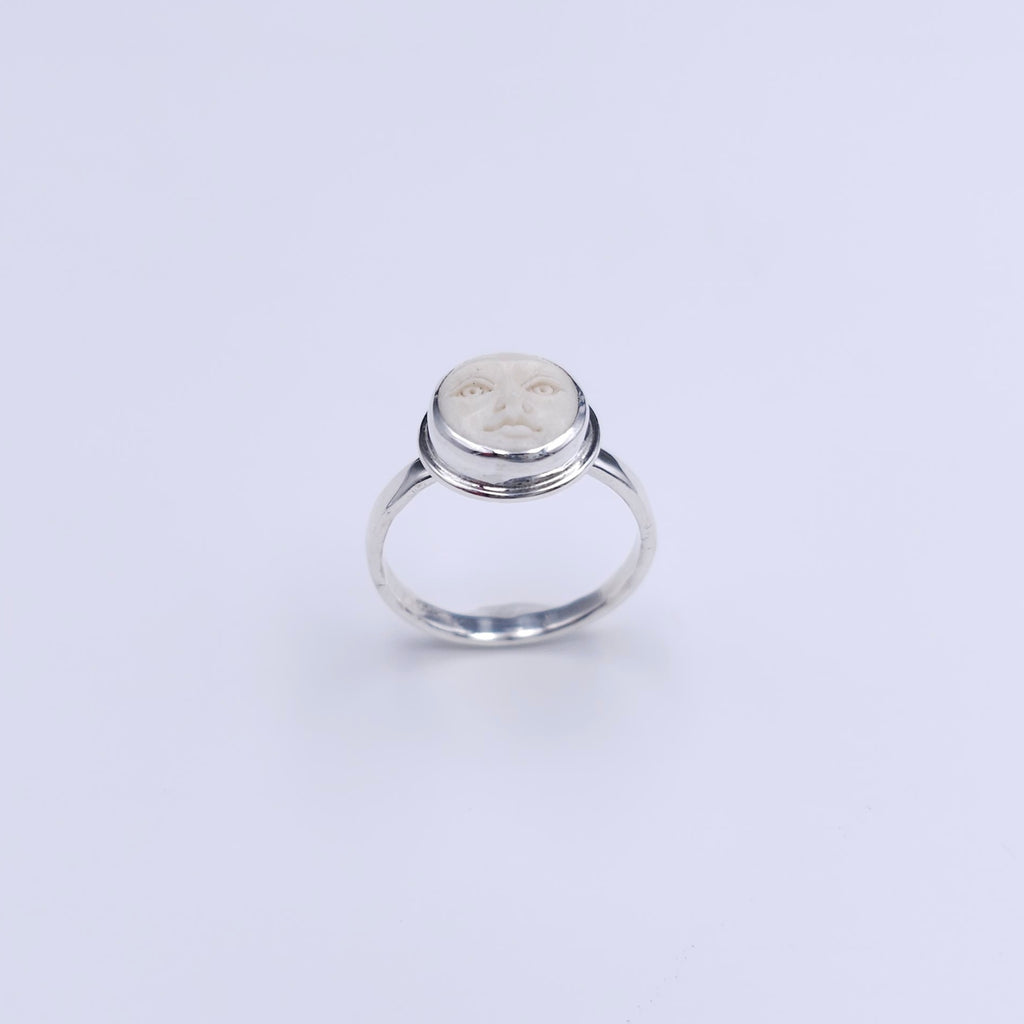 Sterling silver carved face ring