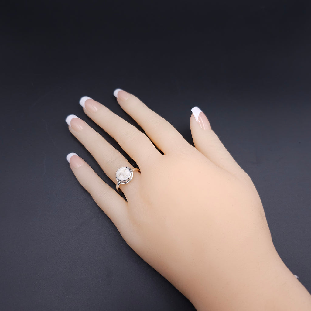 Sterling silver carved face ring