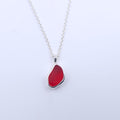 Teardrop freeform shaped red sea glass bezel set silver necklace