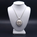 Carved face sterling silver necklace