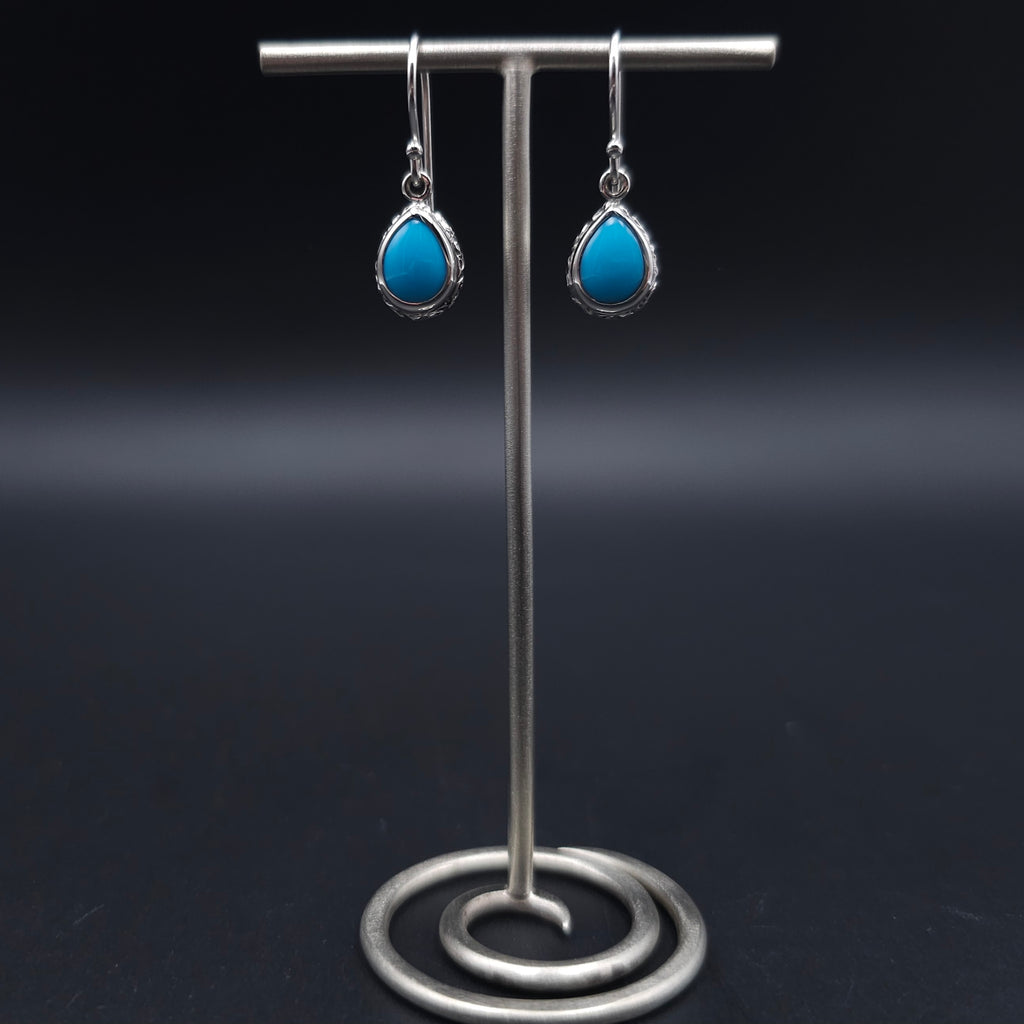 Turquoise teardrop sterling silver dangle earrings with floral border
