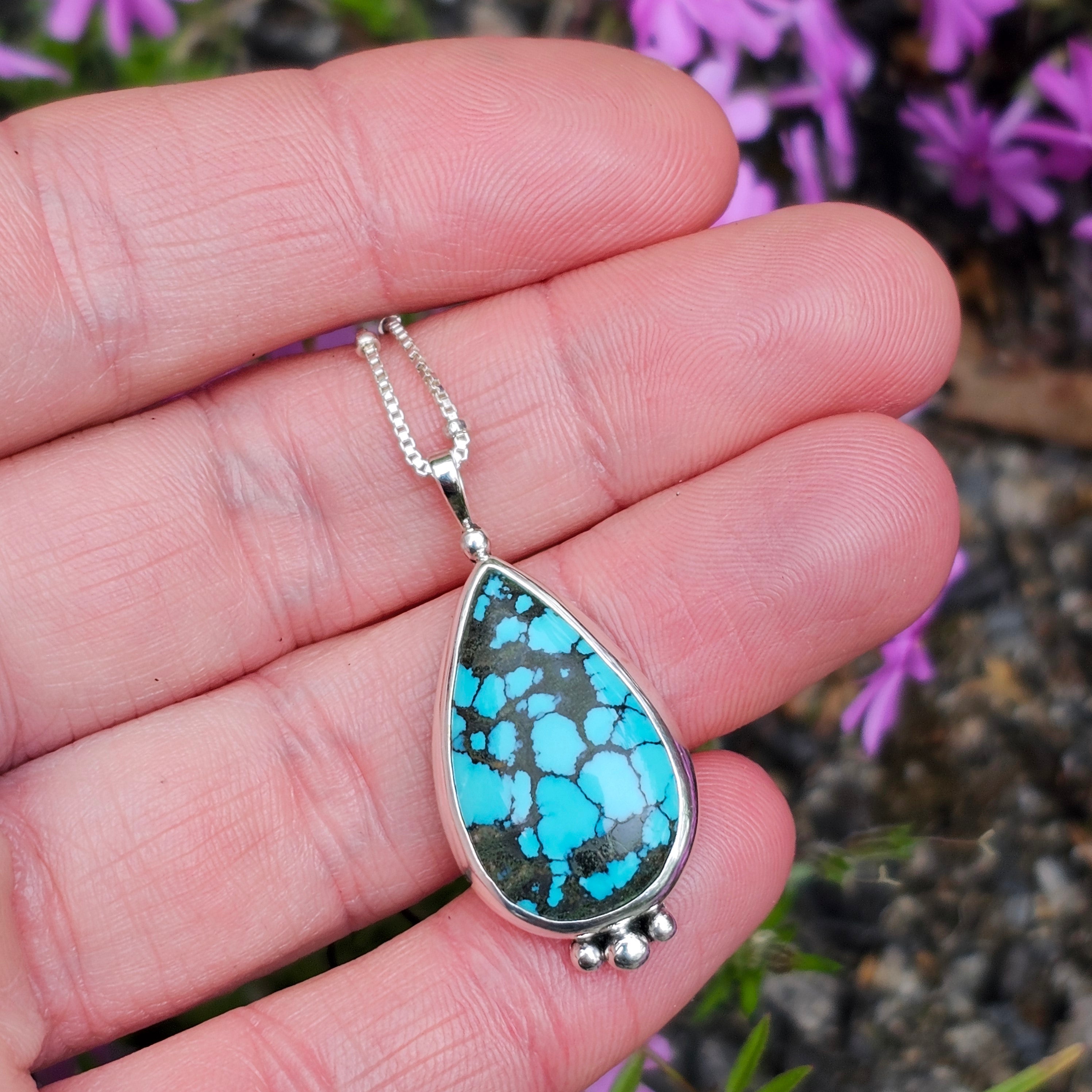 Teardrop bezel turquoise pendant with silver ball accents