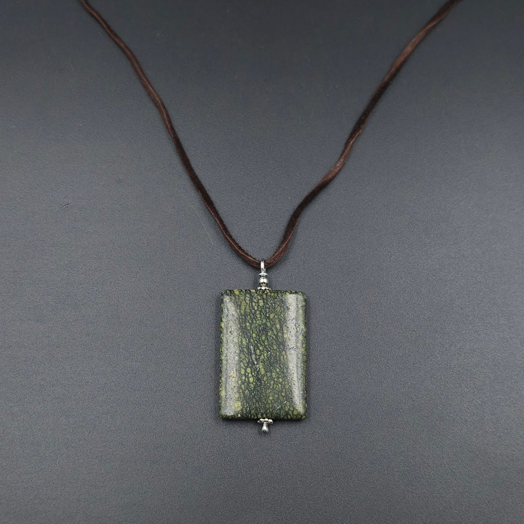 Rectangle spotted green pendant on brown cord