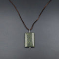 Rectangle spotted green pendant on brown cord
