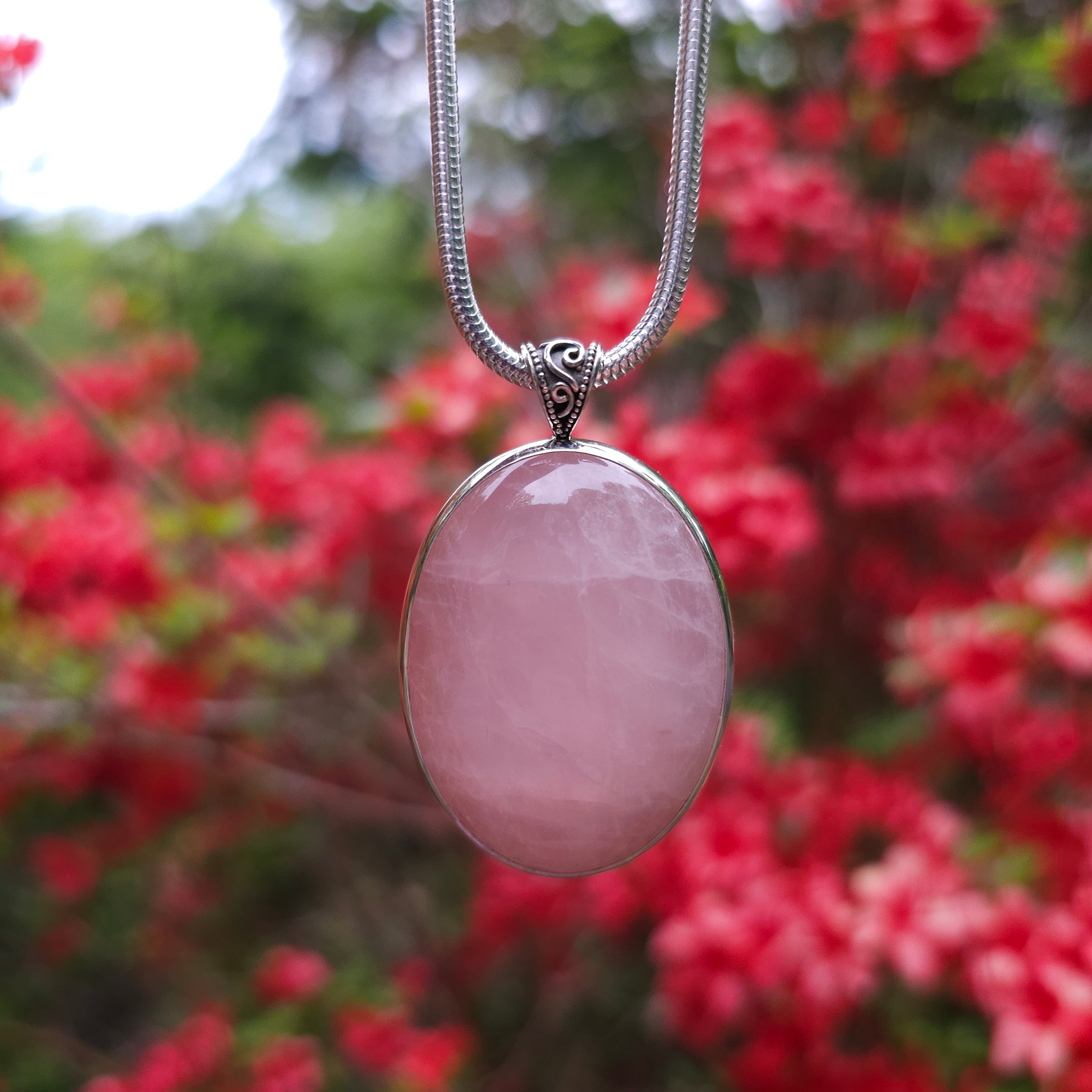 Large oval rose quartz bezel set sterling silver necklace