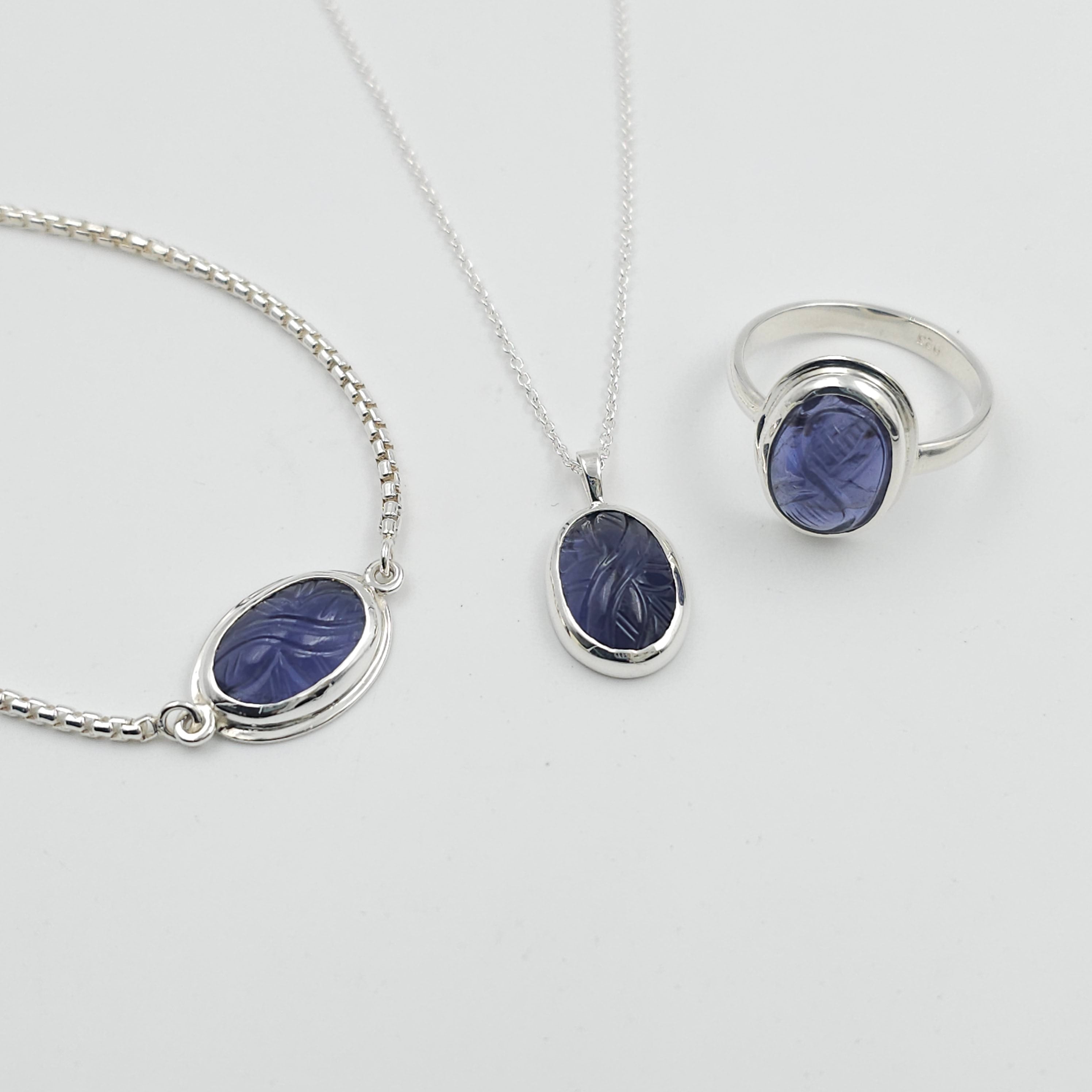 Carved iolite bezel set sterling silver necklace