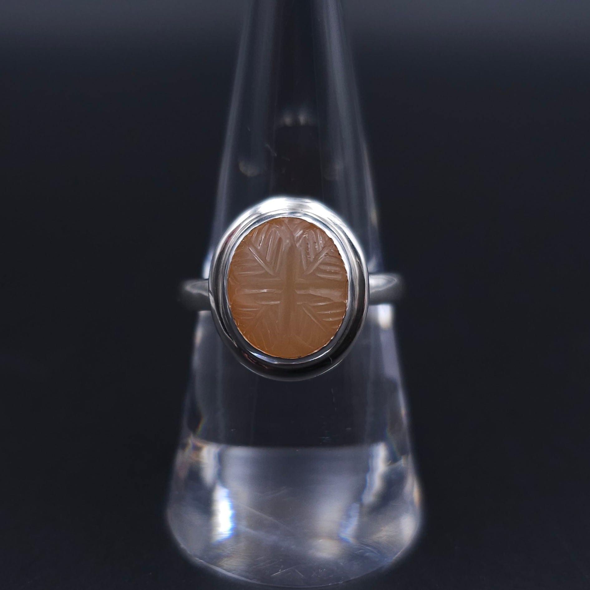 Carved peach moonstone sterling silver ring