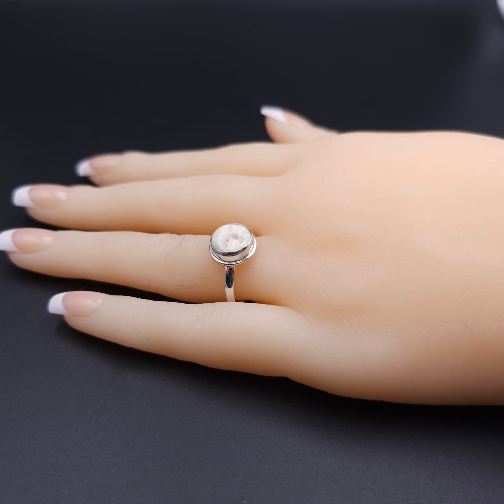 Sterling silver carved face ring