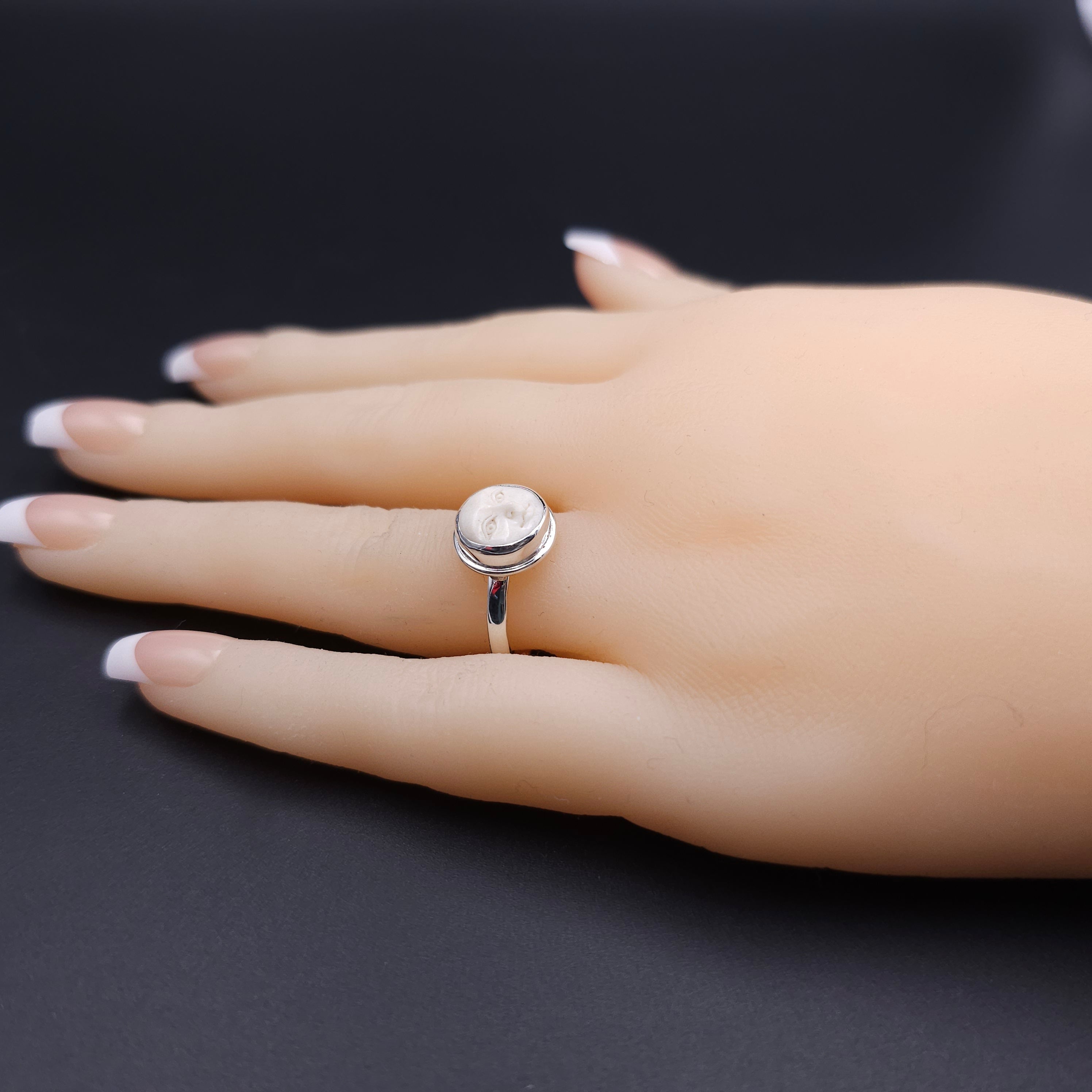 Sterling silver carved face ring