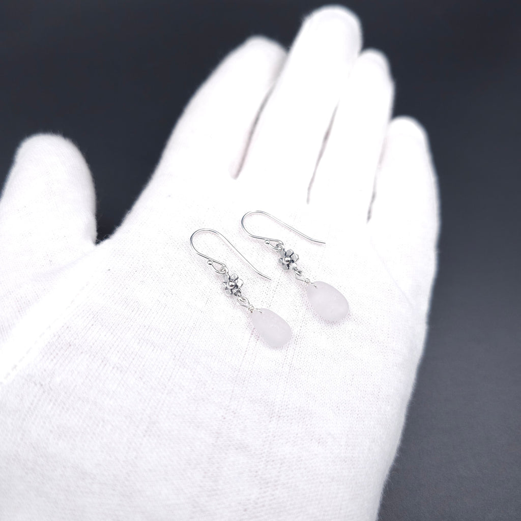 Light purple sea glass dangle earrings with flower accents in sterling silver
