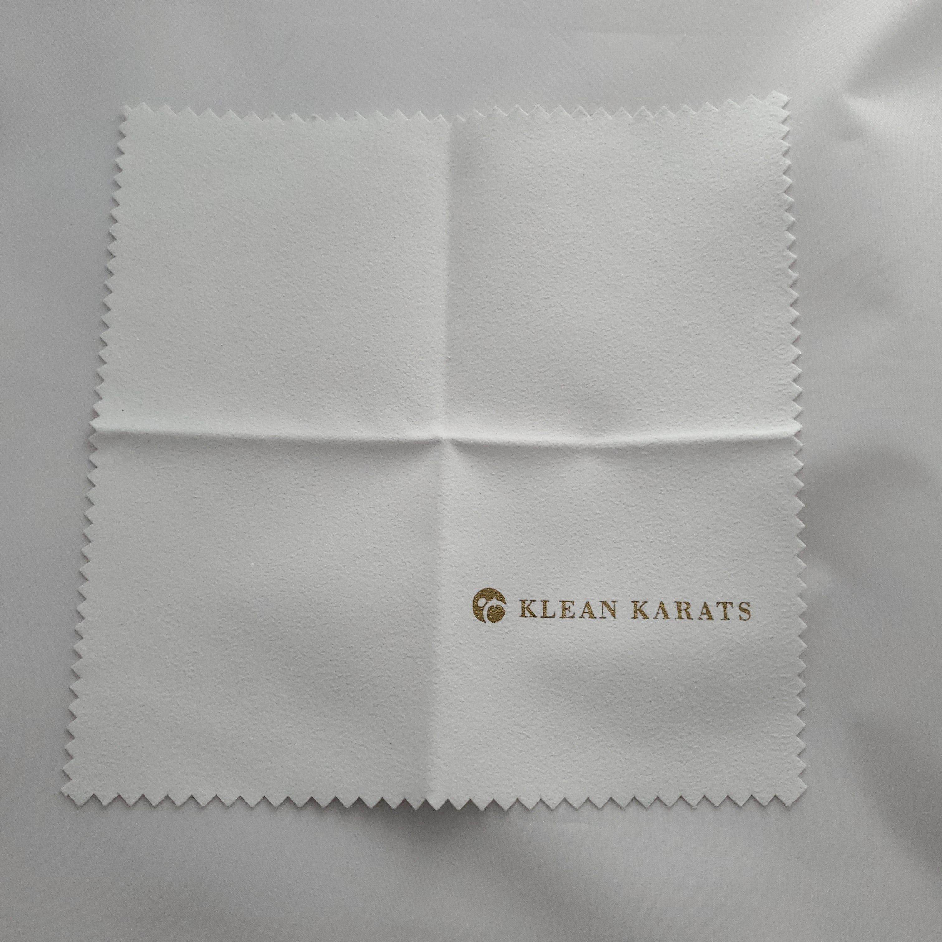Polishing cloth shown unfolded out of package.