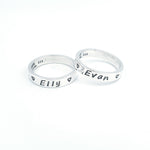 Two silver name rings with names Elly and Evan