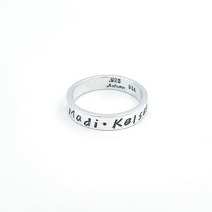 Silver band with names stamped on
