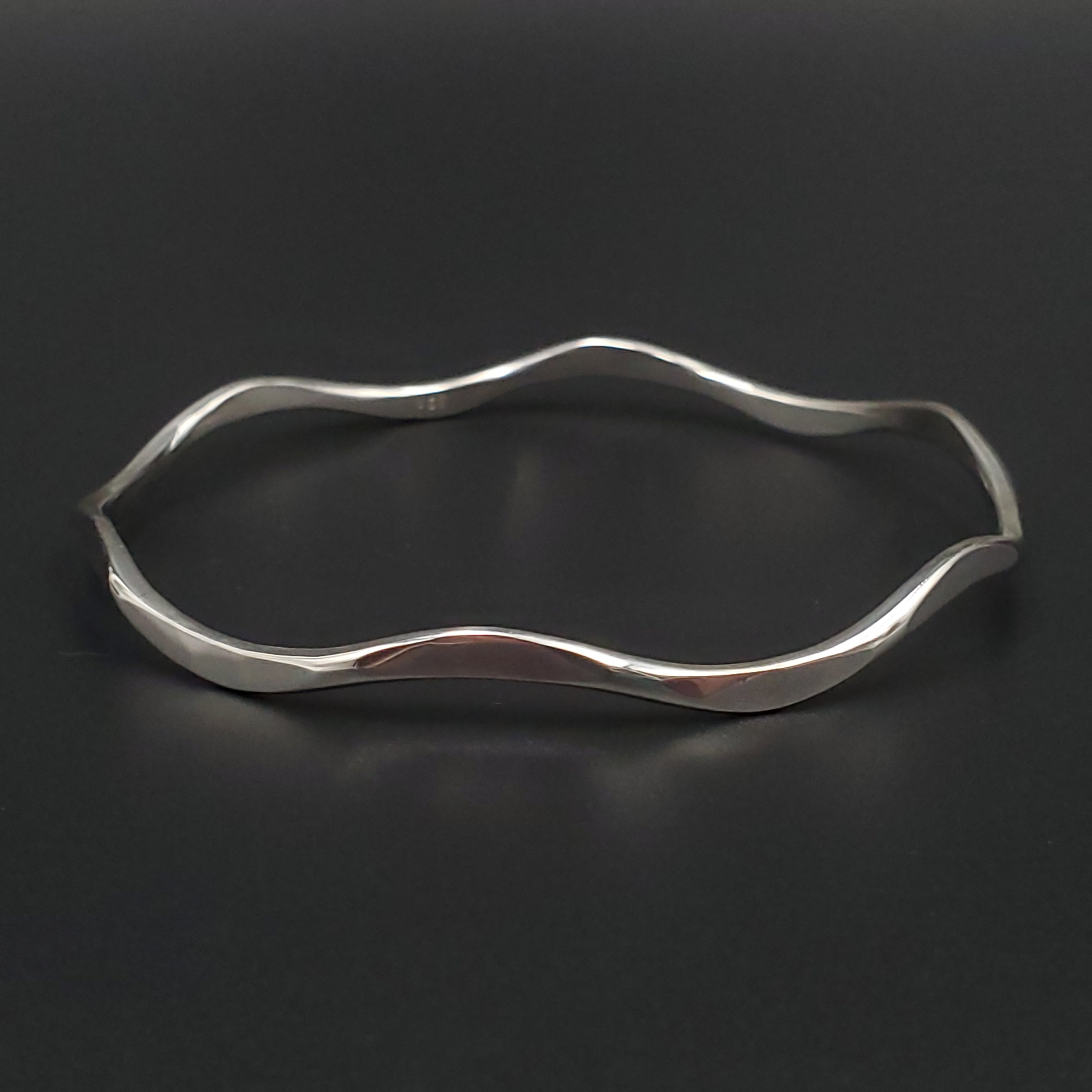 curvy silver hammered bangle bracelet