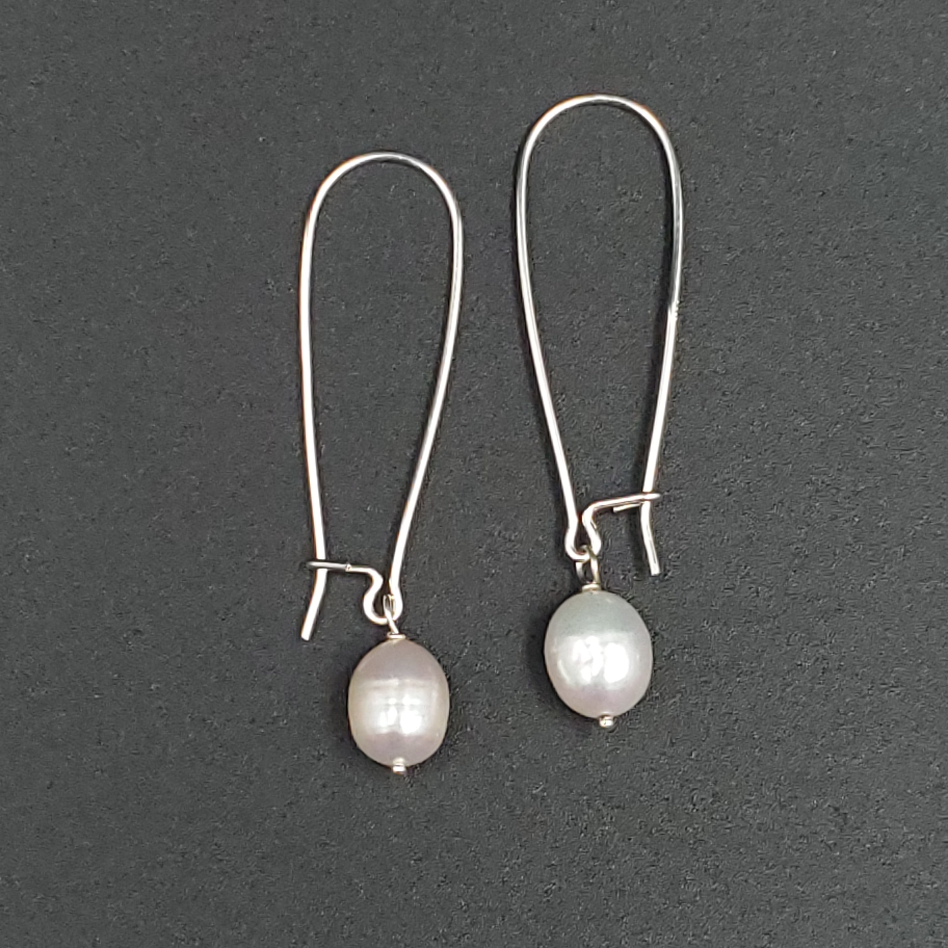 Long silver earrings with fresh water pearls