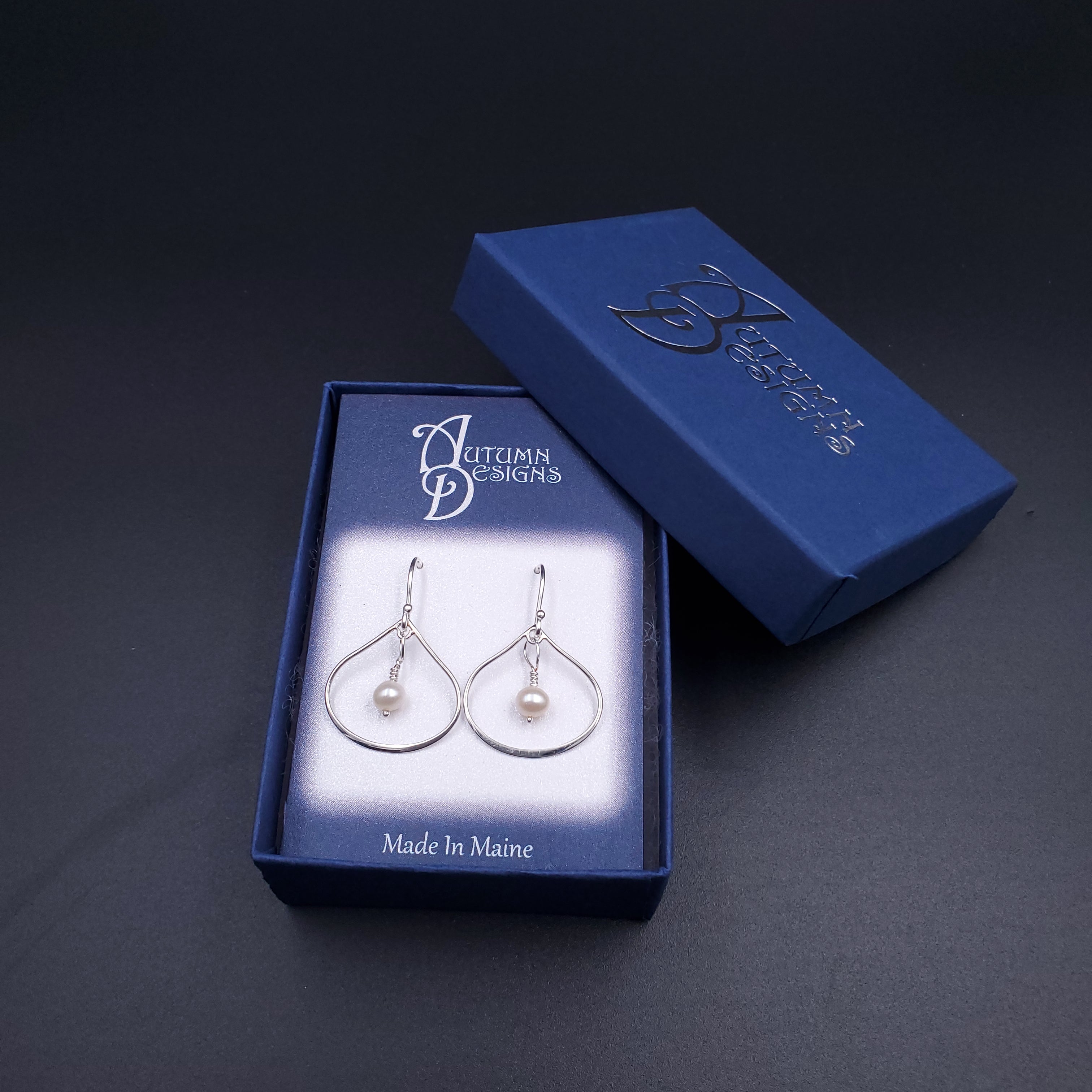 silver teardrop earrings with pearl accents shown in gift box