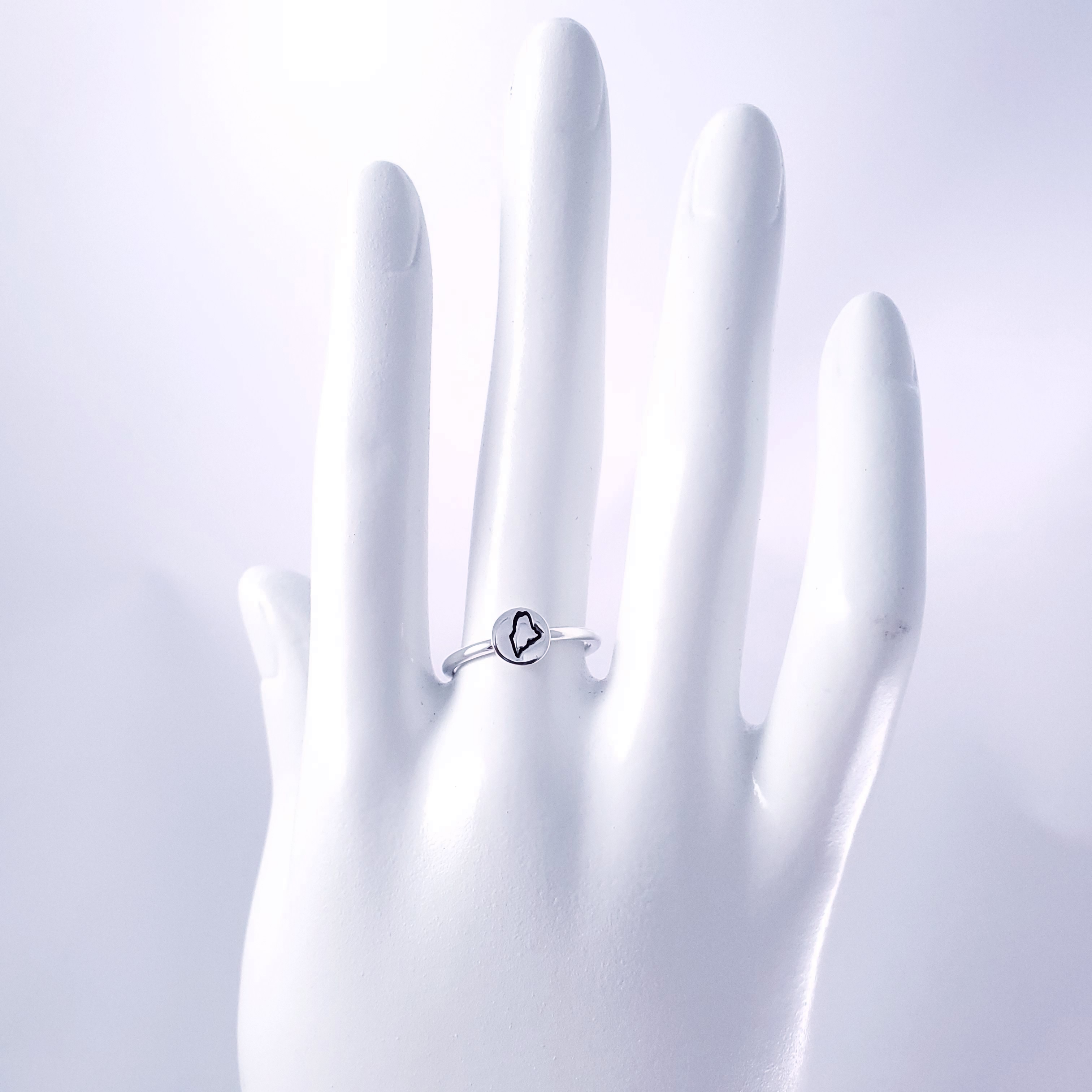 Maine ring on mannequin hand