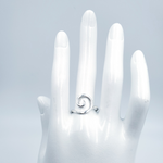 Spiral silver ring on mannequin hand