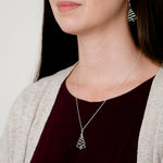 Christmas tree necklace and earring shown on model
