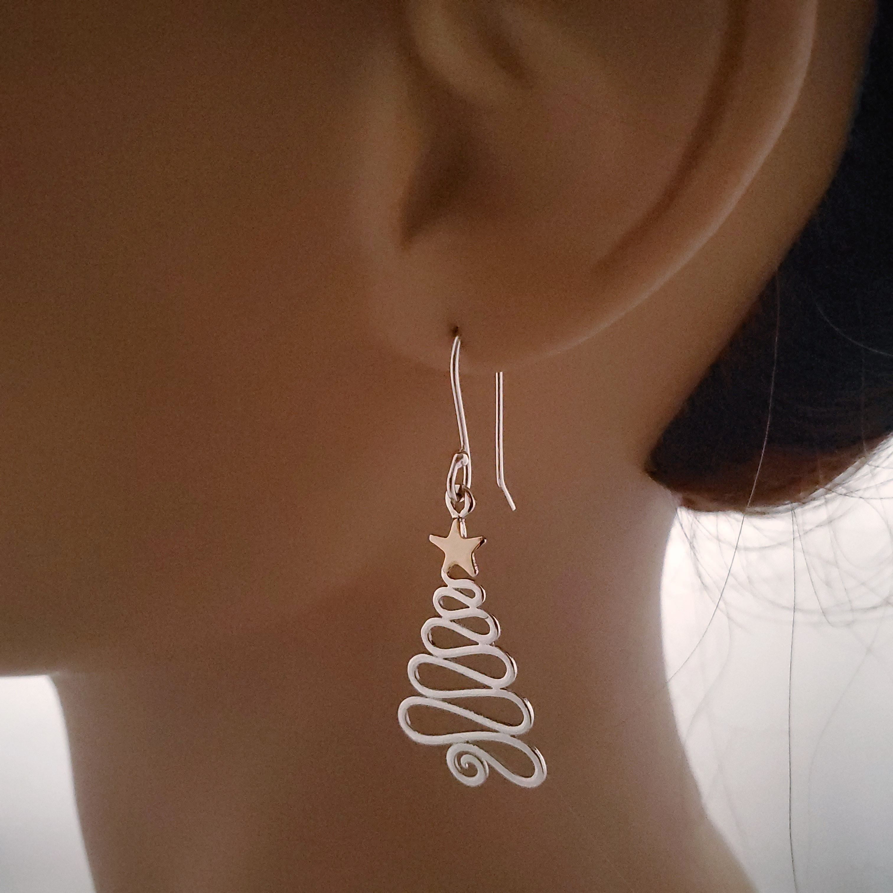 Swirly silver Christmas tree earrings with gold-filled star
