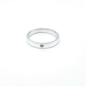 Silver band with small heart stamped into silver