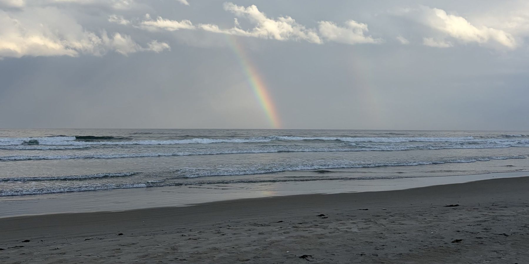 Rainbow over the ocean at a beach in York, Maine